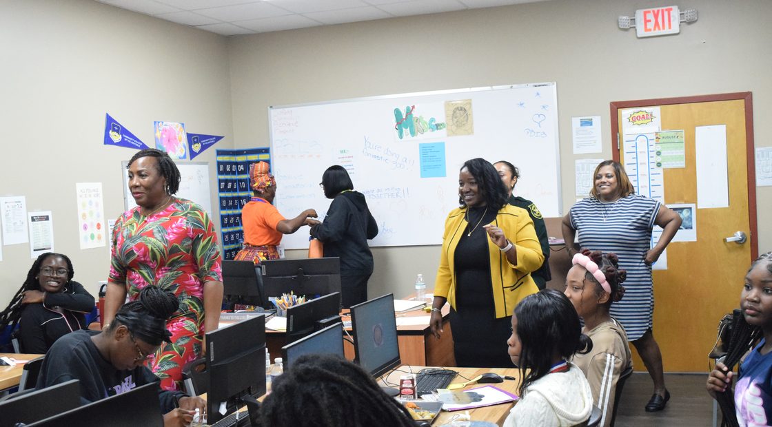 Sunfire staff and students together in a classroom